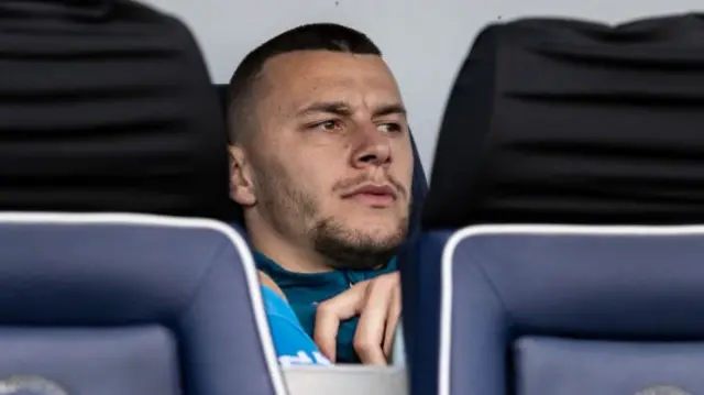 Milutin Osmajic watching Preston North End's match against Millwall from the bench