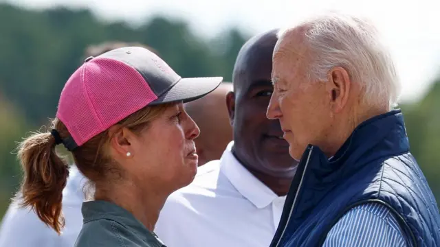 U.S. President Joe Biden greets Esther Manheimer, mayor of Asheville, North Carolina, at Greenville-Spartanburg International Airpor