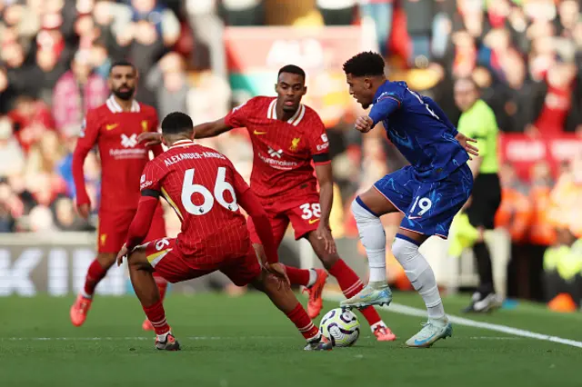 Jadon Sancho of Chelsea controls the ball under pressure from Trent Alexander-Arnold and Ryan Gravenberch