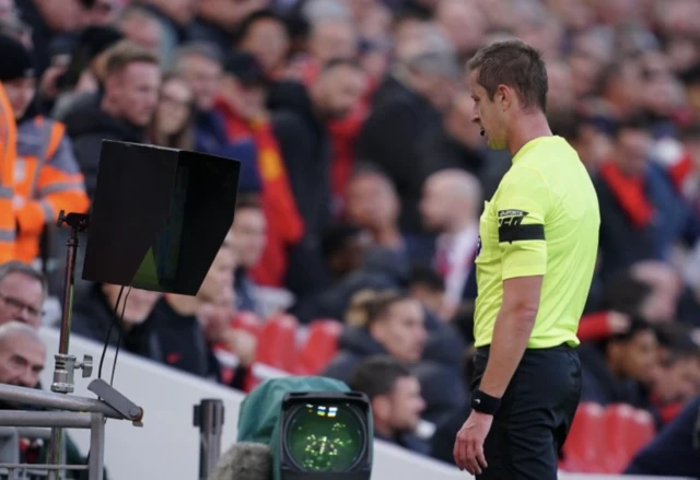 John Brooks completes an on field VAR check to review a penalty