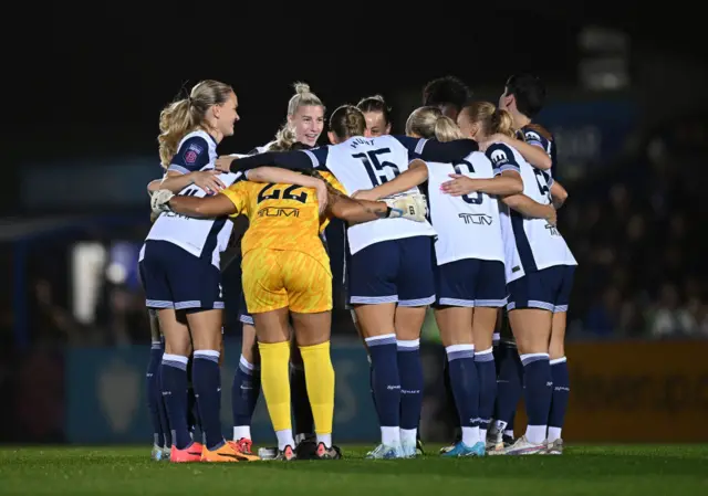 Players of Tottenham Hotspur huddle