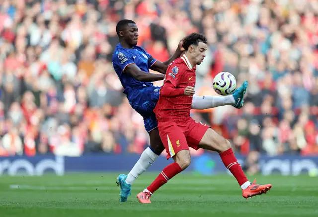 Curtis Jones of Liverpool battles for possession