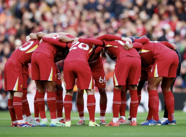 Liverpool team huddle