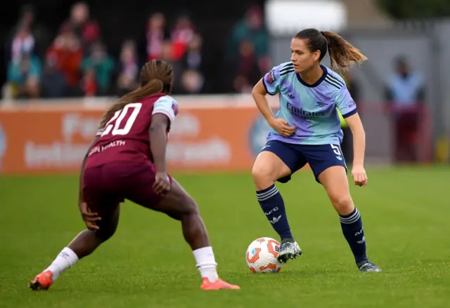 Laia Codina of Arsenal controls the ball whilst under pressure from Viviane Asseyi