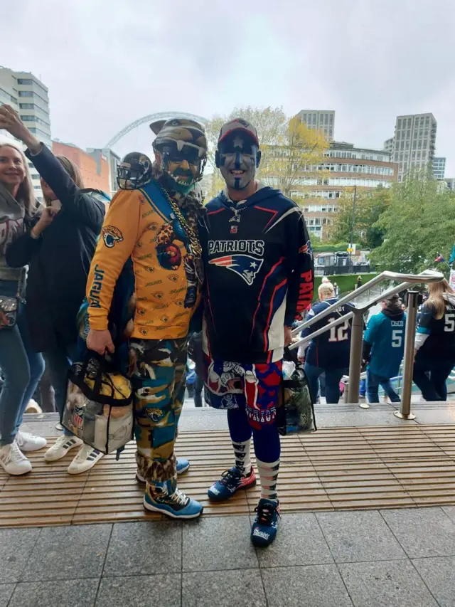 A Jacksonville Jaguars fan with a New England Patriots fan on Wembley Way