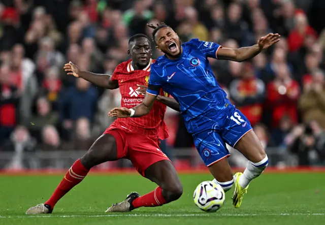 Nicolas Jackson of Chelsea is challenged by Ibrahima Konate