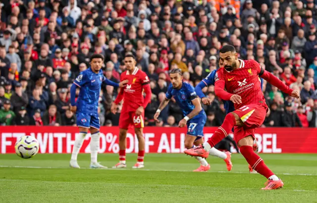 Liverpool's Mohamed Salah scores