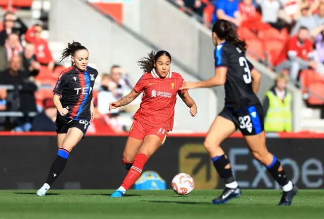 Olivia Smith of Liverpool runs with the ball