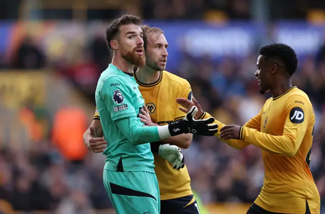 Jose Sa of Wolverhampton Wanderers is congratulated by Craig Dawson and Nelson Semedo