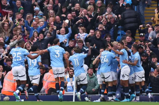 Man City players celebrating a goal