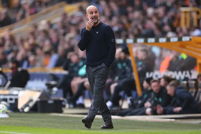 Pep Guardiola manager of Manchester City reacts