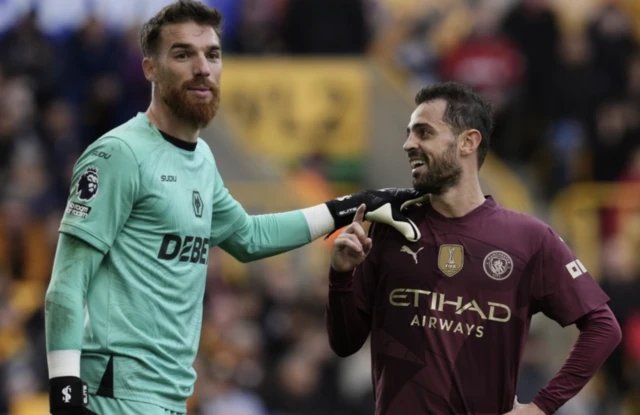 Jose Sa (left) and Manchester City's Bernardo Silva