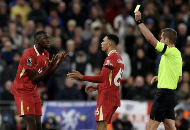 Ibrahima Konate is shown a yellow card