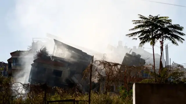 Smoke rising from damaged buildings in the Choueifat district in the southern suburbs of Beirut
