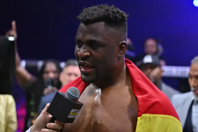 A tearful Francis Ngannou speaks in the cage