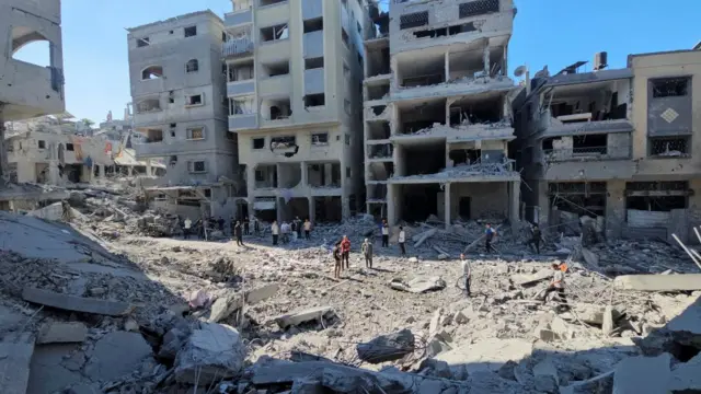 Wide shot of damaged buildings in Beit Lahia, northern Gaza, after an Israeli strike overnight on Saturday 19 Oct