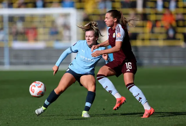 Noelle Maritz of Aston Villa is challenged by Lauren Hemp