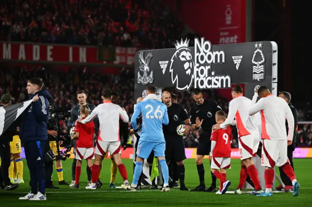 Players shake hands before kick off