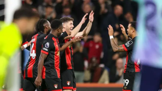 Bournemouth players celebrating after scoring against Arsenal