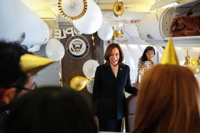 Harris is surprised on her 60th birthday by campaign staff with birthday decorations on Air Force Two