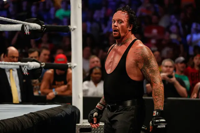 Mark Calaway aka the Undertaker photographed outside of a wrestling ring