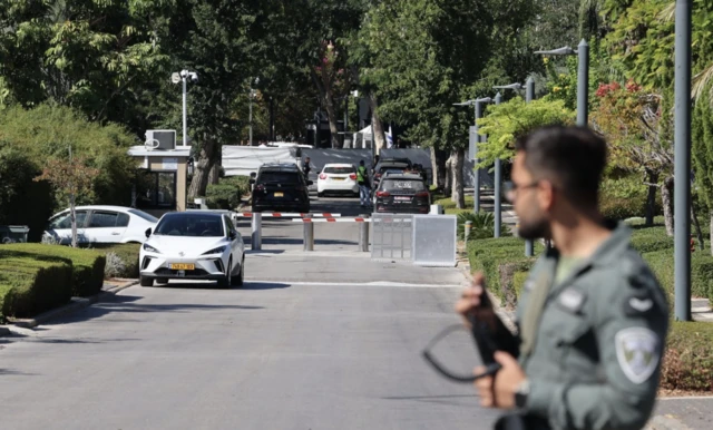 Israeli police at the scene targeted by unmanned aerial vehicle (UAV) fired from Lebanon, in Caesarea