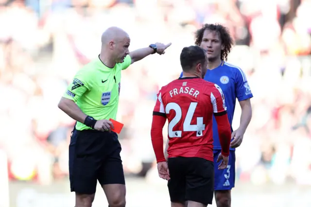 Ryan Fraser being directed off the pitch after getting sent off against Leicester City