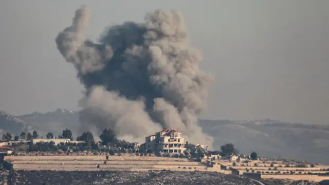 Smoke billows over Khiam, amid ongoing border hostilities between Hezbollah and Israeli forces, as pictured from Marjayoun, near the border with Israel, October 21