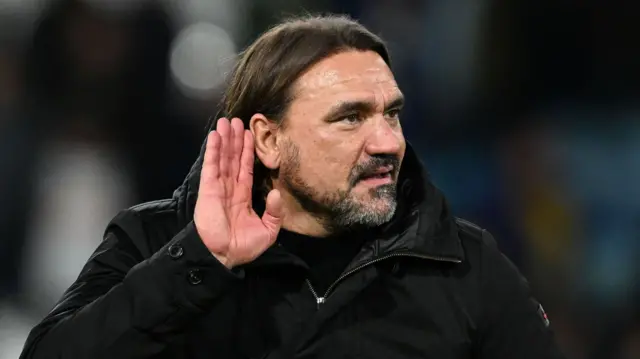 Daniel Farke cups his ear to the crowd