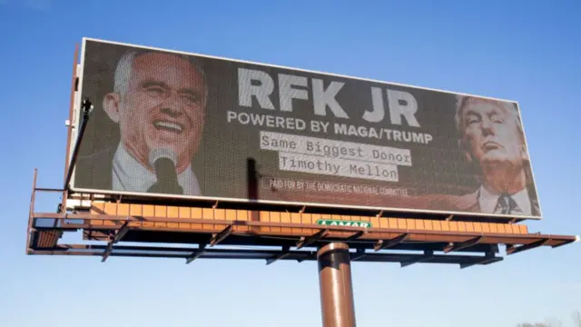 A billboard showing RFK Jr and Donald Trump