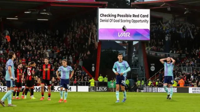 VAR sign at Bournemouth game says: "Checking possible red card - denial of goal scoring opportunity"