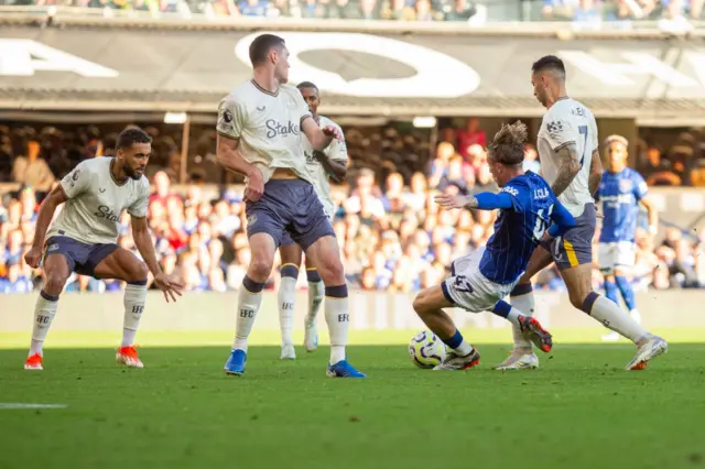 Jack Clarke goes to ground after contact with Dwight McNeil