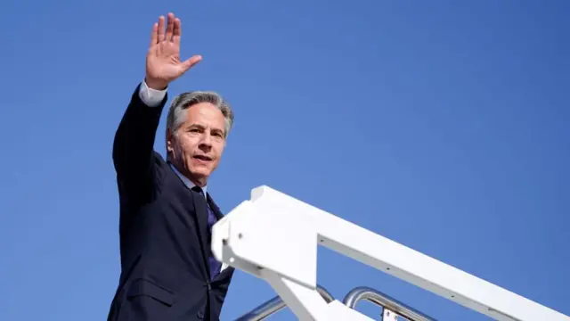 U.S. Secretary of State Antony Blinken boards a plane, en route to the Middle East, as he departs Joint Base Andrews, Maryland,