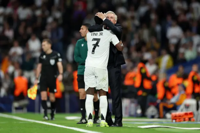 Vinicius Junior of Real Madrid celebrates with Carlo Ancelotti, Head Coach of Real Madrid