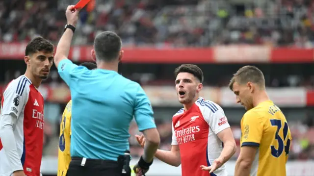 Arsenal's Declan Rice is shown a second yellow card and sent off by referee Christopher Kavanagh