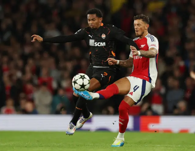 Shakhtar Donetsk's Eguinaldo in action with Arsenal's Ben White