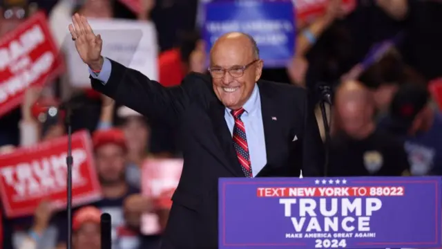 A file photo of Rudy Giuliani speaking at a rally for Trump last month