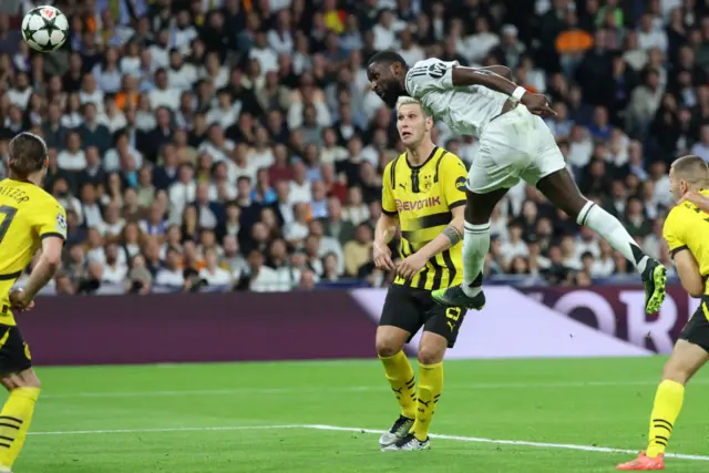 Real Madrid's German defender Antonio Rudiger scores their first goal