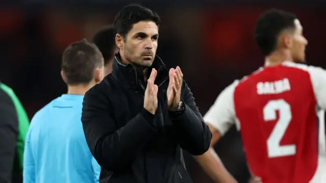 Mikel Arteta, head coach of Arsenal, applauds after the UEFA Champions League match