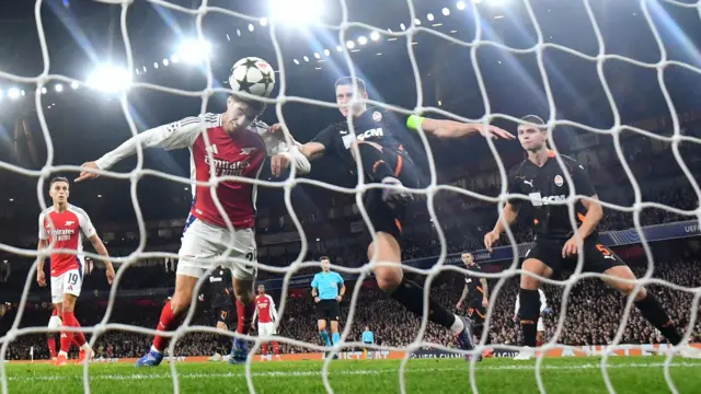 Shakhtar Donetsk's Mykola Matviyenko in action as he clears the ball from Arsenal's Kai Havertz