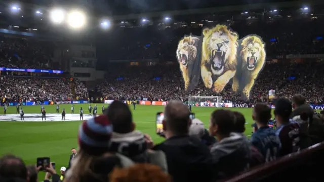 A general view inside the Villa Park as a Tifo featuring an image of a lion is seen prior to kick-off