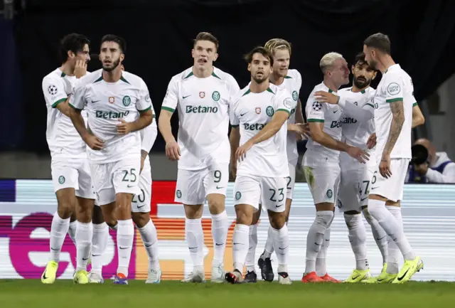 Sporting's Nuno Santos celebrates scoring their first goal with teammates