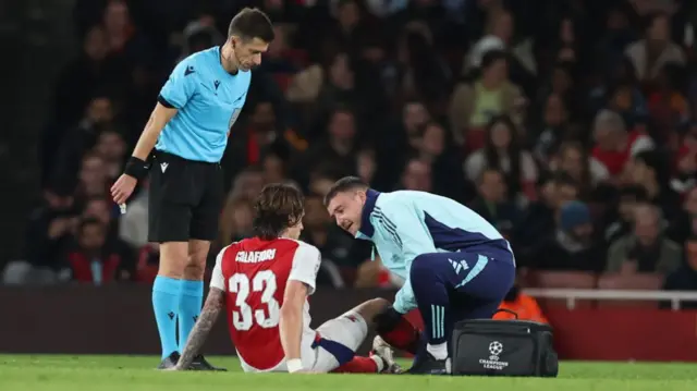 An injured Riccardo Calafiori of Arsenal during the UEFA Champions League