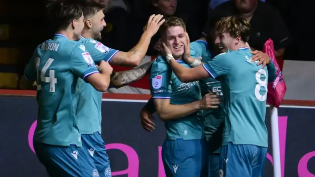 Reading players celebrate with goalscorer Michael Craig