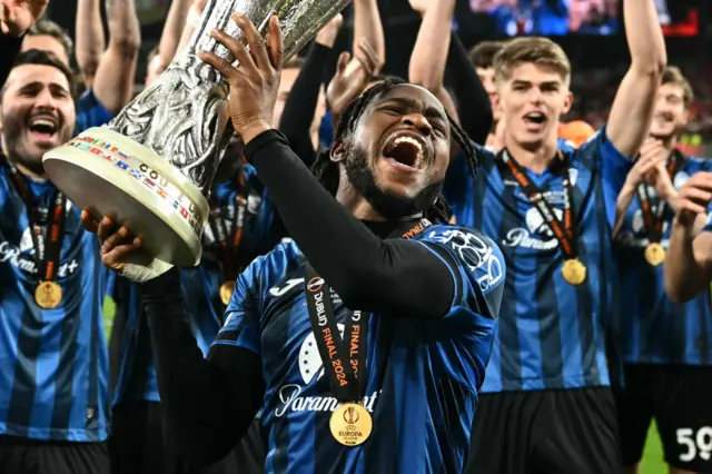 Ademola Lookman celebrates with the Europa League trophy