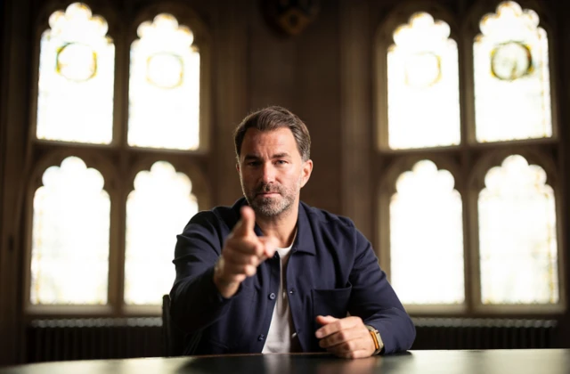 Eddie Hearn points his finger into the camera