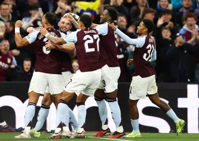 John McGinn celebrates with his Aston Villa team-mates after scoring against Bologna