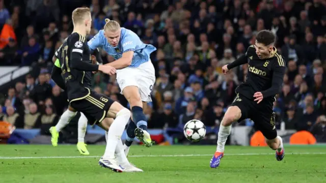 Erling Haaland of Manchester City scores his team's fourth goal