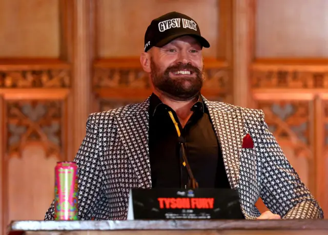 Tyson Fury in a black and white suit