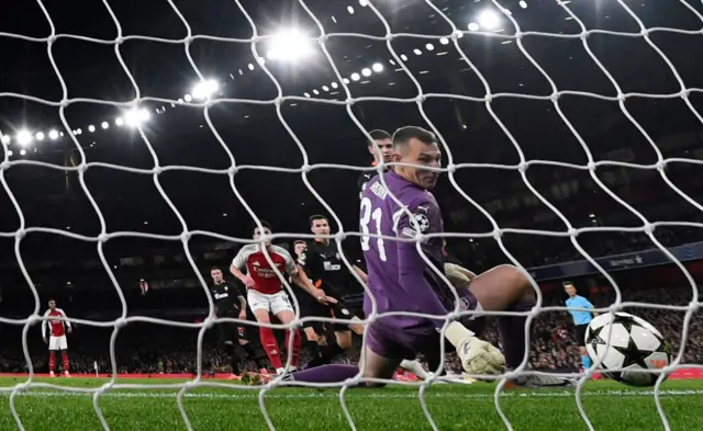 Shakhtar Donetsk goalkeeper Dmytro Riznyk looks on as the ball rebounds off him into the net